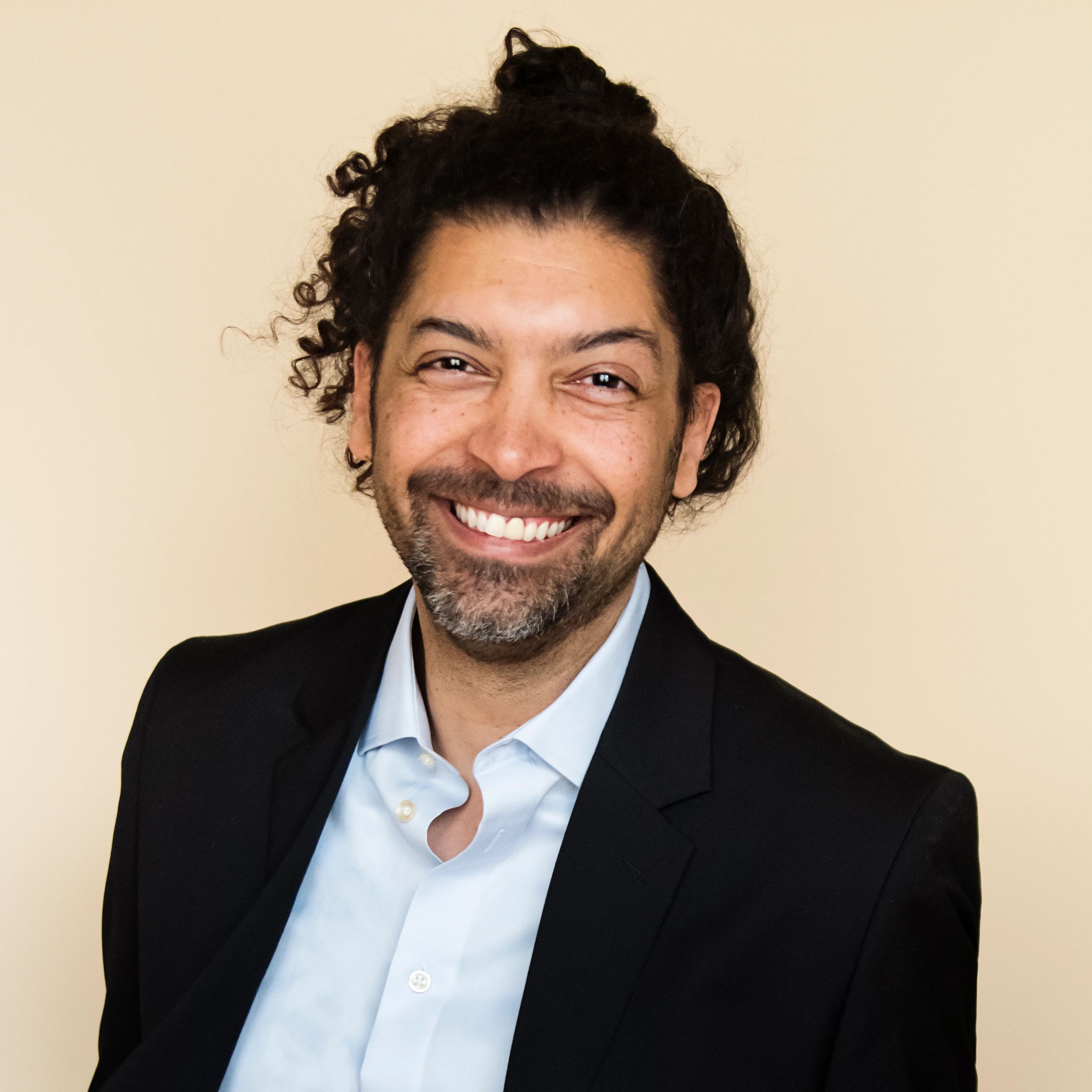 Professional portrait representing community partnerships