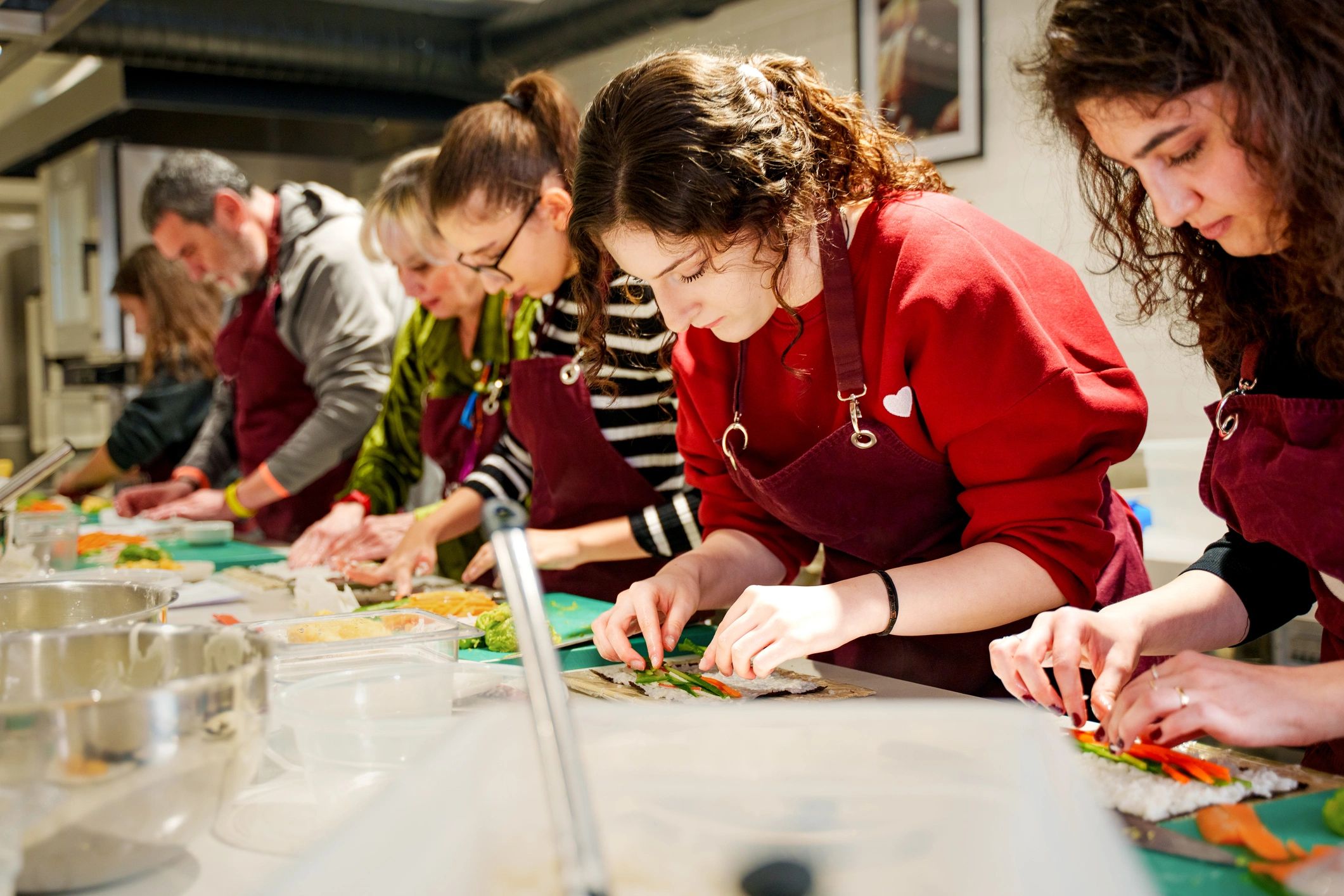 Participants taking part in a hands-on nutrition and cooking workshop