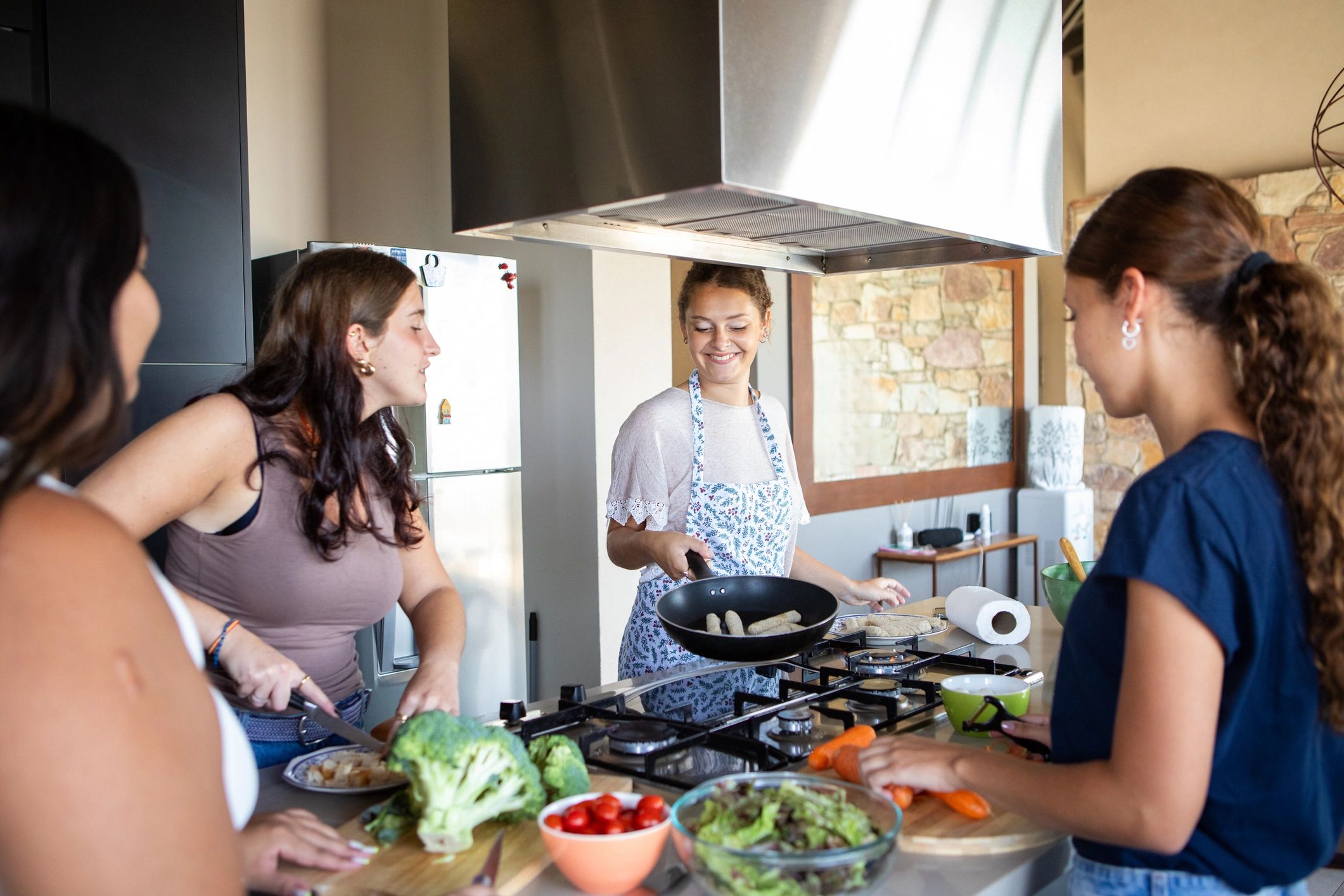 Women preparing a healthy salad together